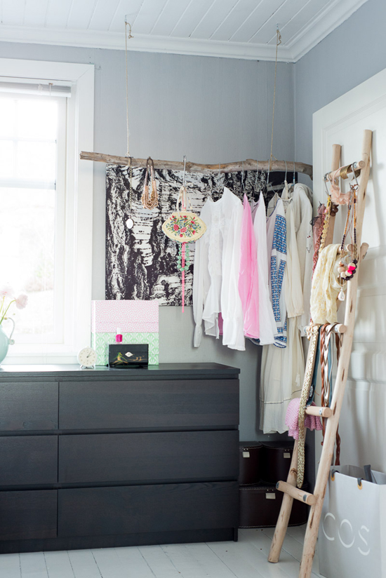 Exposed closet made from driftwood branch