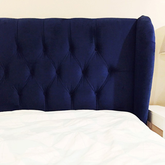 Blue upholstered bed