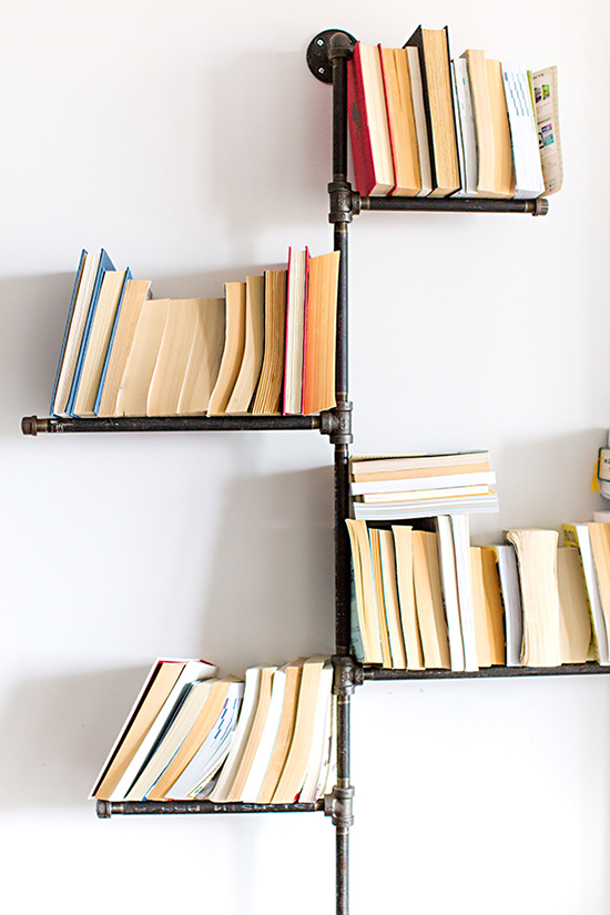 DIY pipe bookshelves -- so cool!