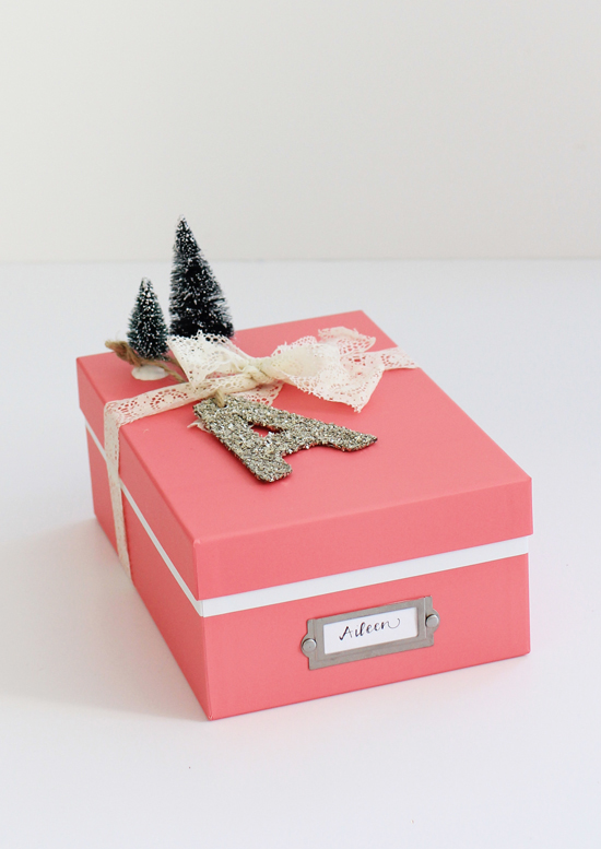 Gift-wrap idea: use a pretty photo box that can be kept afterward