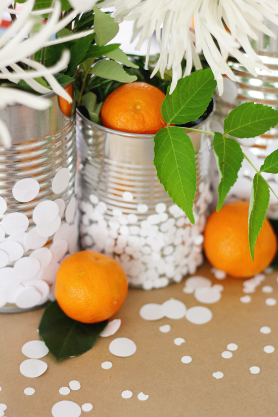 Add confetti to tin cans (just punch circles out of white printer's paper)