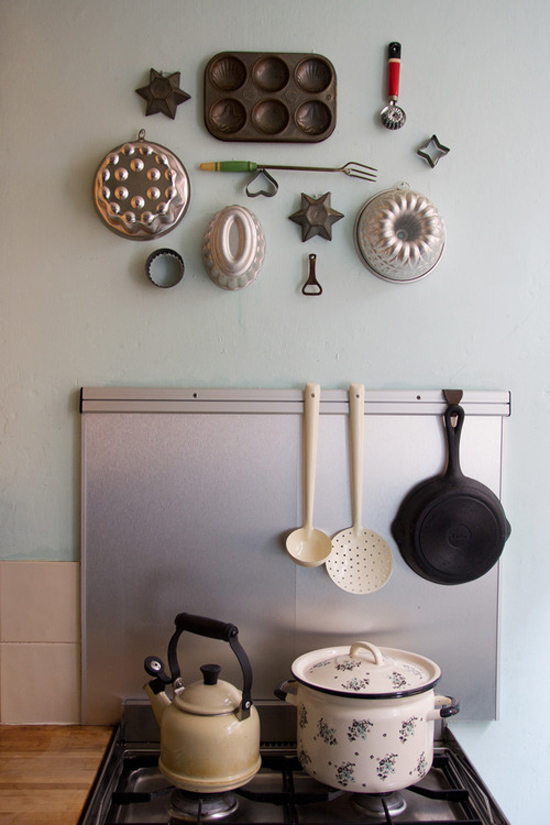Vintage utensils mounted on the kitchen wall