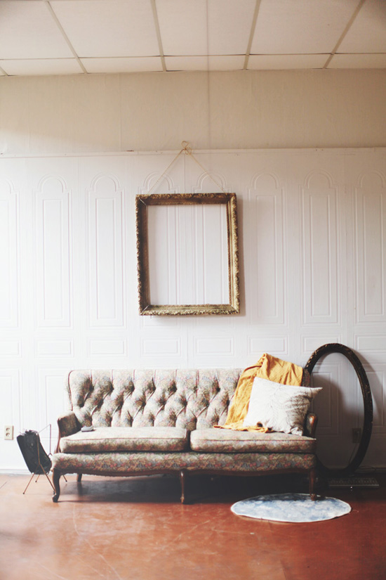 Tufted sofa and empty frames
