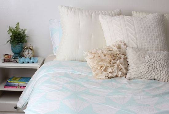 Bed with mint green duvet