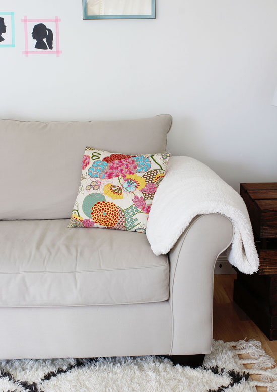 Colorful pillow and sheepskin throw