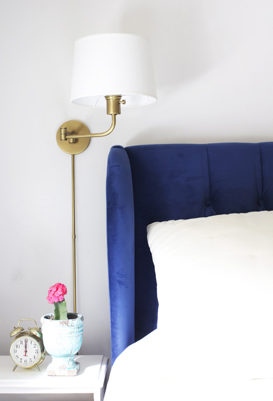 Bedroom with wall sconces