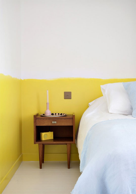 Bedside table and half-painted wall
