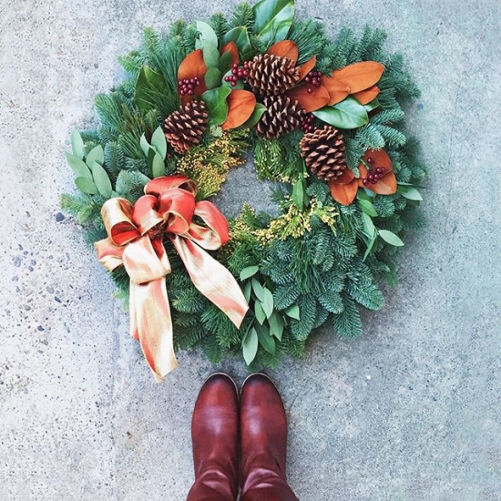Wreath with magnolia leaves, berries, and pinecones