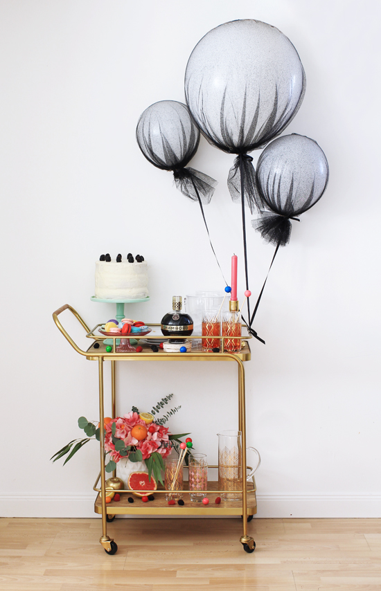 Bar cart with tulle-covered balloons