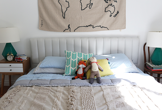 Boys room with map above bed