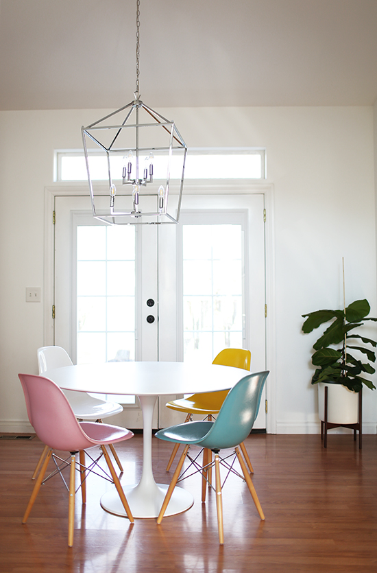 Tulip table, Eames chairs, cage pendant, French doors