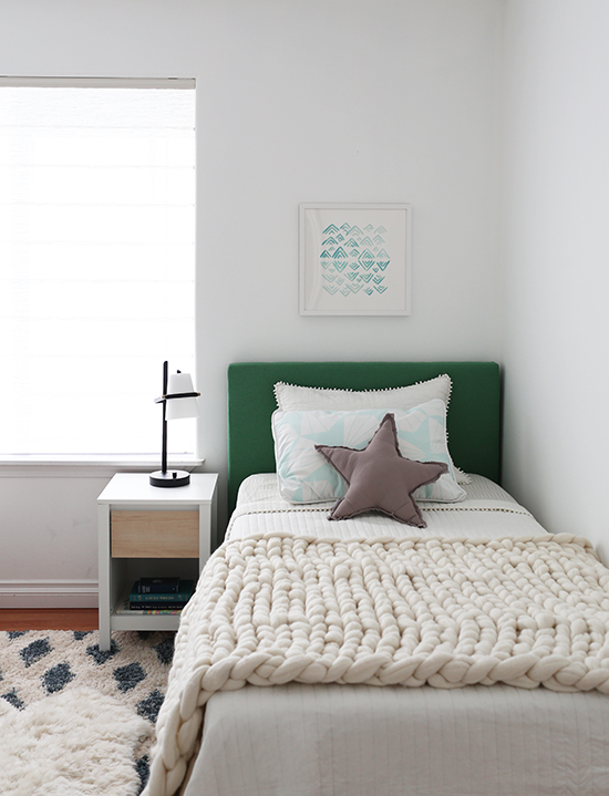 Neutral kids room with a pop of green