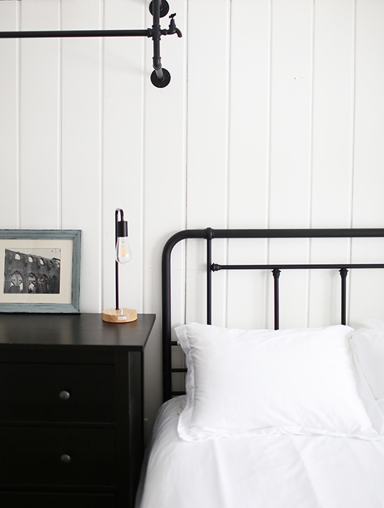 Iron bed and simple white bedding